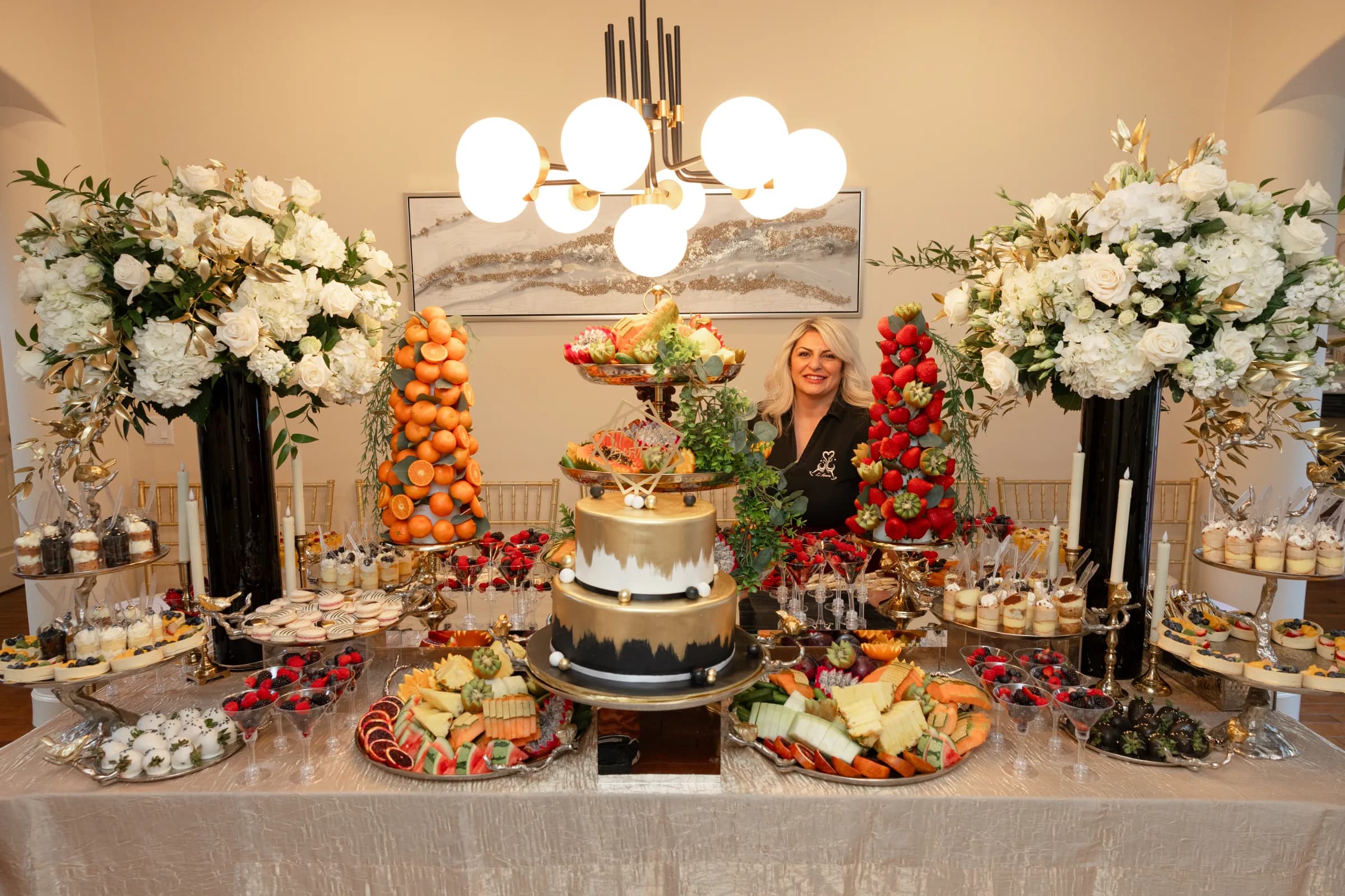 Ilona standing behind a L’Amore fruit and sweets display